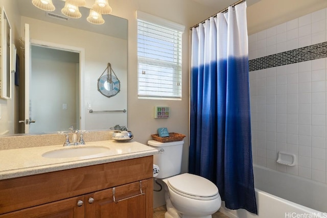 full bathroom with shower / bath combination with curtain, vanity, and toilet