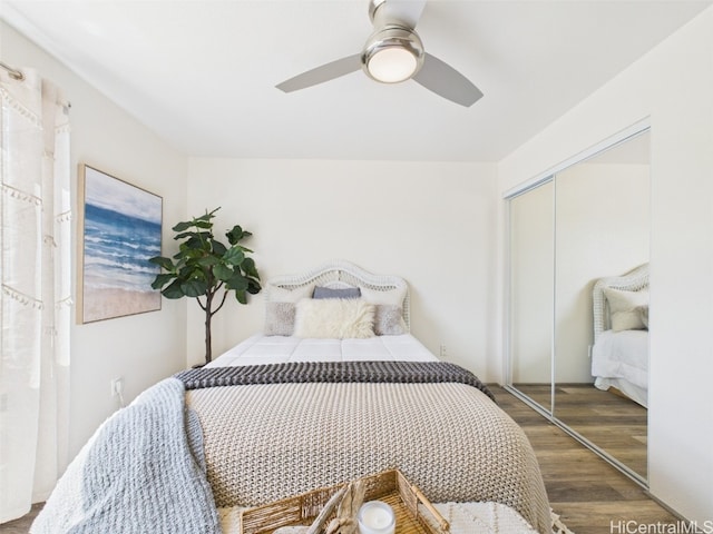 bedroom featuring wood finished floors, a closet, and ceiling fan