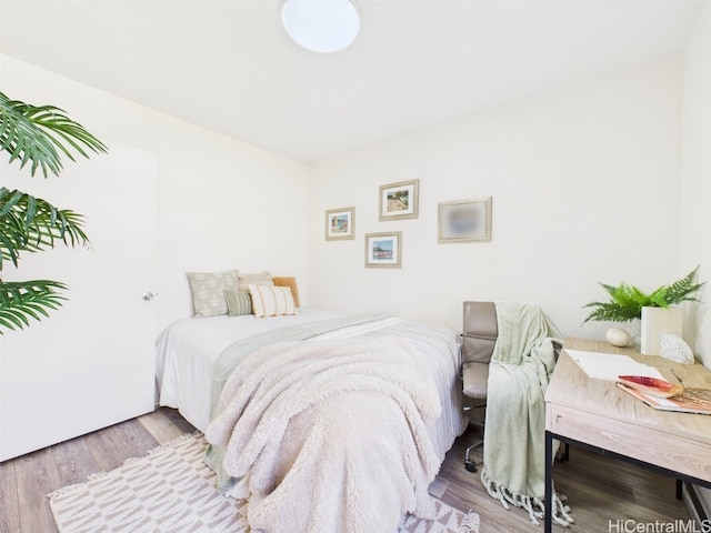 bedroom with wood finished floors