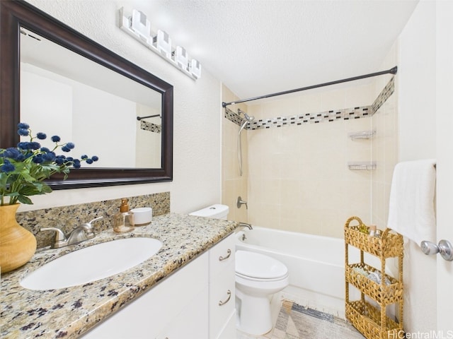 full bath featuring toilet, a textured ceiling, vanity, and bathtub / shower combination