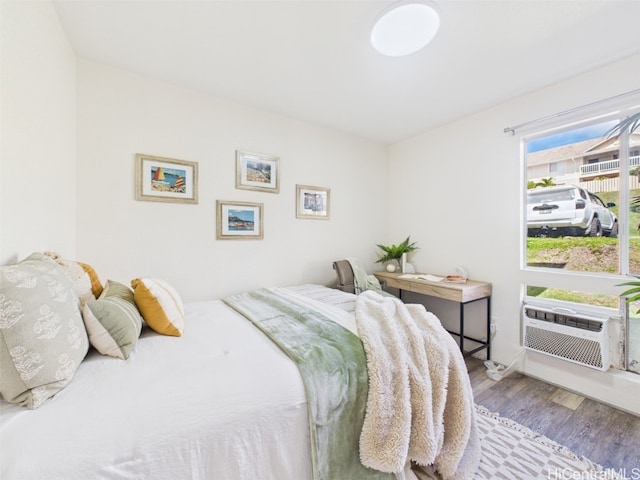 bedroom featuring wood finished floors