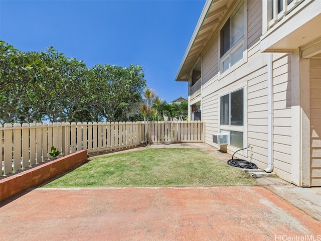 view of yard featuring a patio area, cooling unit, and a fenced backyard