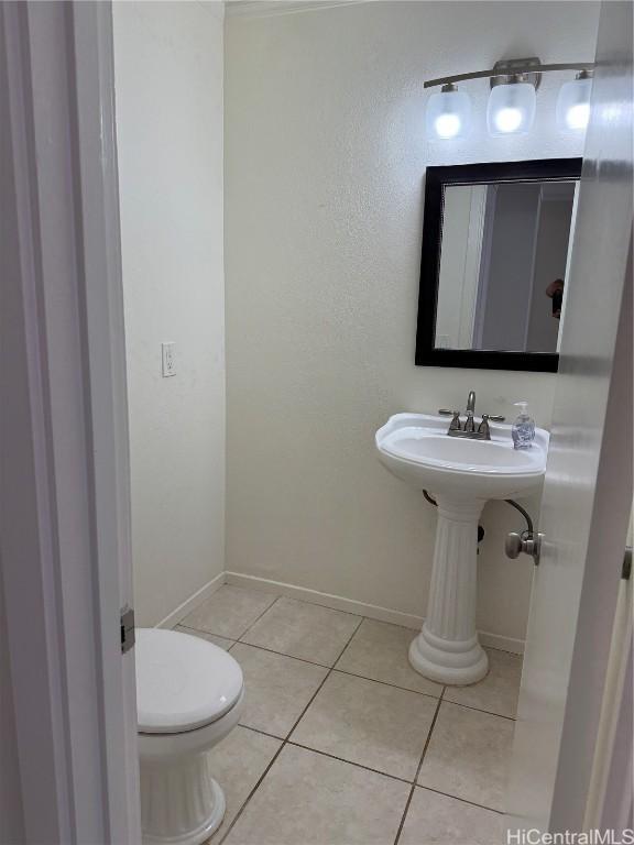 bathroom featuring tile patterned flooring and toilet