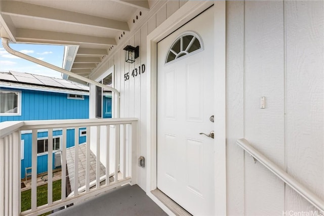 property entrance featuring solar panels