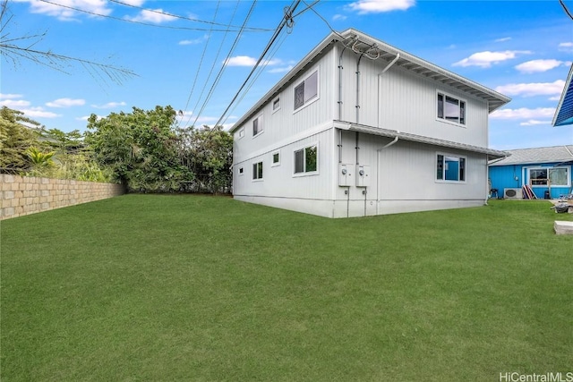 back of house featuring a yard