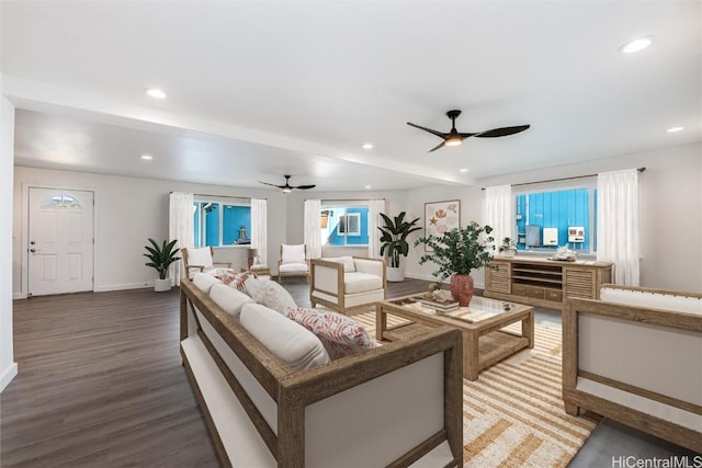 living room featuring hardwood / wood-style flooring and ceiling fan