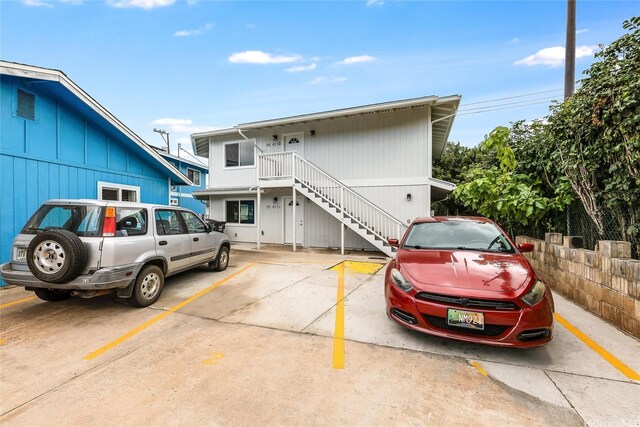 55-431 Iosepa St Unit D, Laie, HI 96762 - view of front facade featuring stairs and uncovered parking