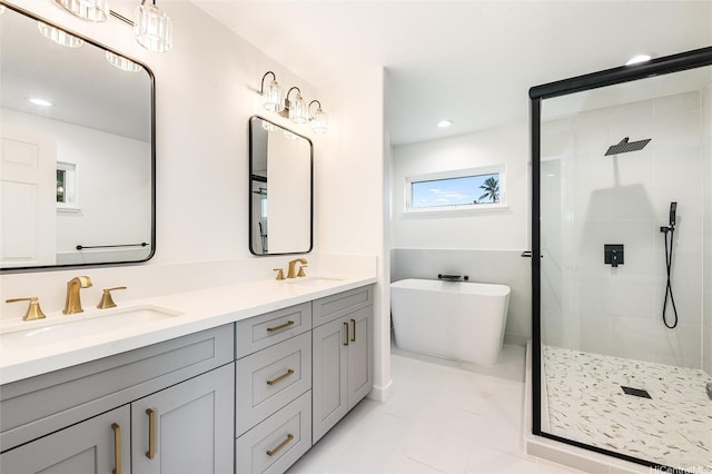 55-431 Iosepa St Unit D, Laie, HI 96762 - bathroom featuring a stall shower, a freestanding tub, double vanity, recessed lighting, and tile patterned flooring