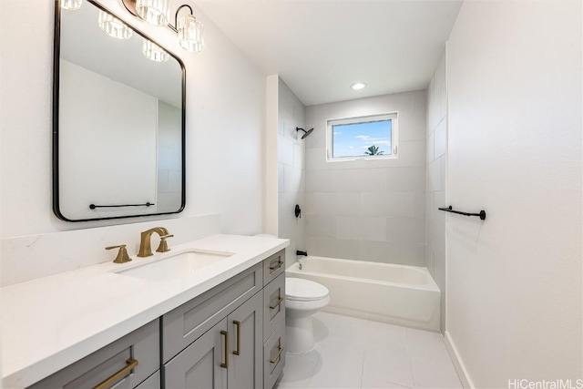 full bathroom with tiled shower / bath combo, vanity, tile patterned floors, and toilet