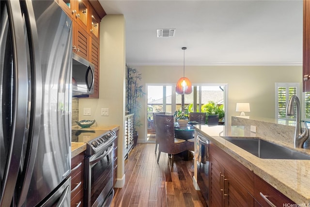 92-1110 Olani St Unit 20-6, Kapolei, HI 96707 - kitchen with glass insert cabinets, ornamental molding, stainless steel appliances, and a sink