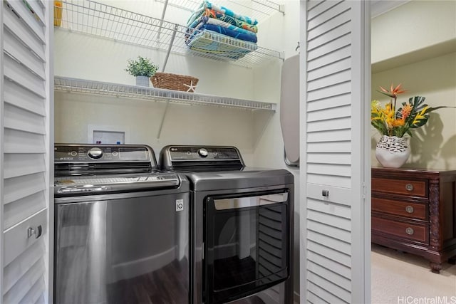 clothes washing area featuring washing machine and dryer