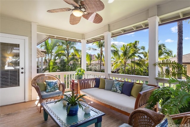 sunroom / solarium featuring ceiling fan