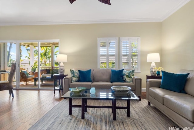 living room with ornamental molding and hardwood / wood-style floors