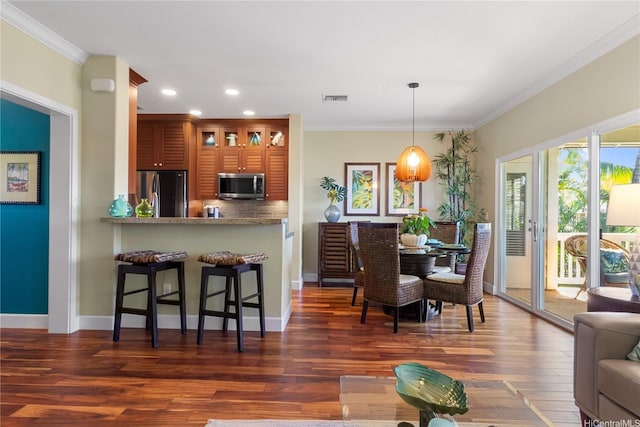 92-1110 Olani St Unit 20-6, Kapolei, HI 96707 - dining space with dark wood finished floors, baseboards, visible vents, recessed lighting, and ornamental molding