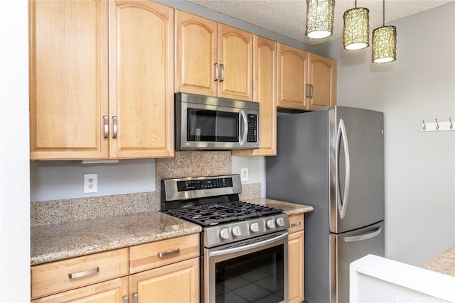 kitchen with a textured ceiling, hanging light fixtures, light brown cabinets, appliances with stainless steel finishes, and decorative backsplash