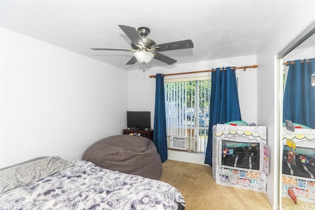 bedroom with cooling unit, ceiling fan, and light carpet