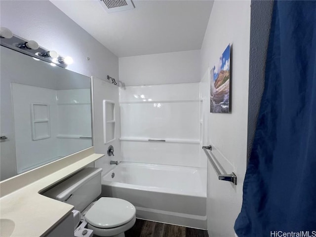 full bathroom featuring shower / tub combination, wood-type flooring, vanity, and toilet