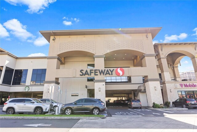 view of commercial location with uncovered parking
