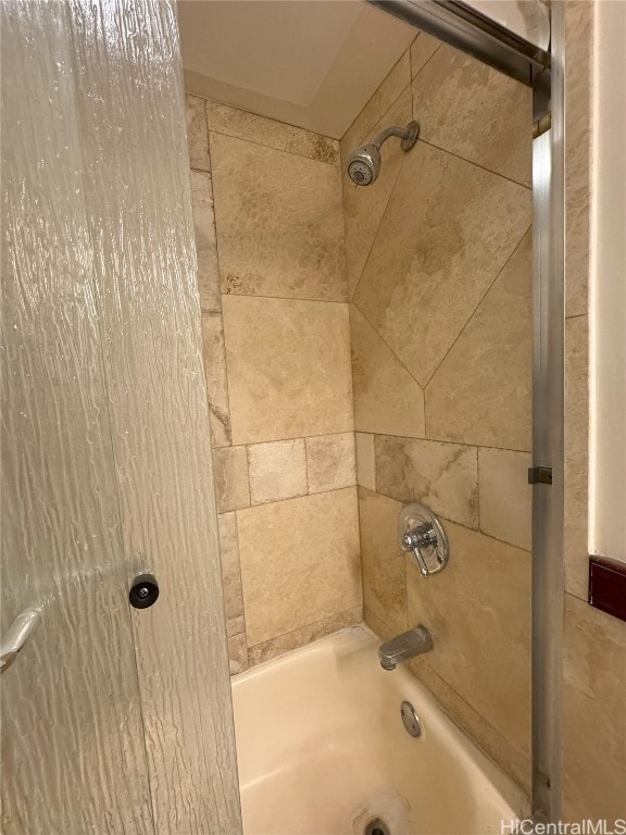 interior details featuring shower / bath combination