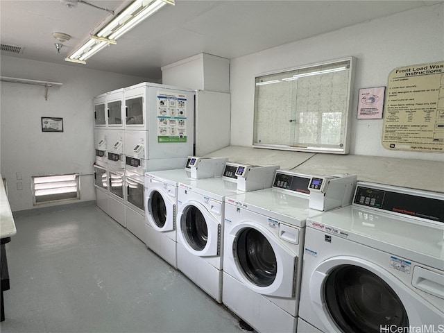 shared laundry area featuring washing machine and dryer, visible vents, and stacked washer / dryer