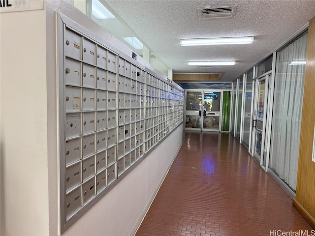 view of community with mail area and visible vents