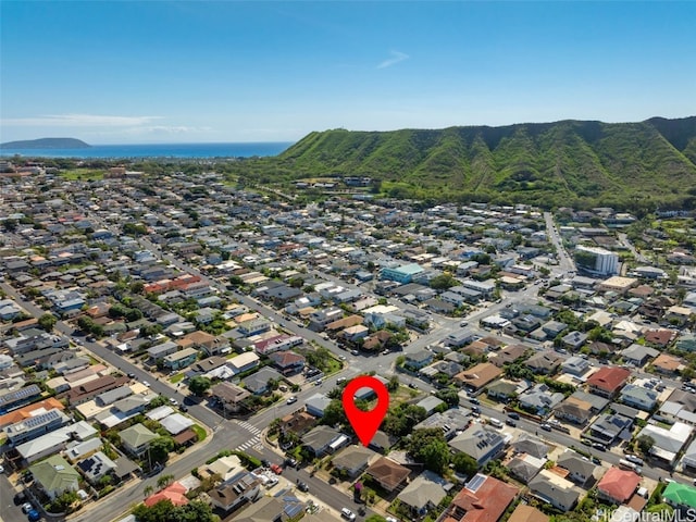 birds eye view of property featuring a mountain view