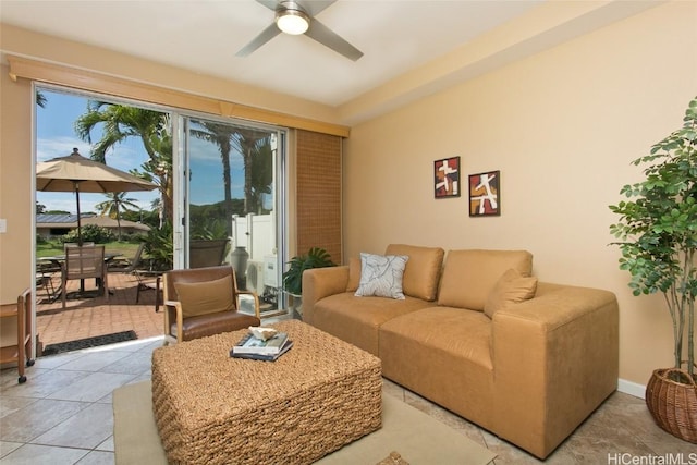 living room featuring light tile patterned flooring and ceiling fan