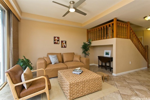 tiled living room with ceiling fan