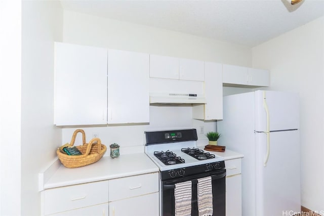 kitchen with white cabinetry, range with gas stovetop, and white fridge