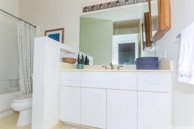 full bathroom with vanity, shower / tub combo, and toilet