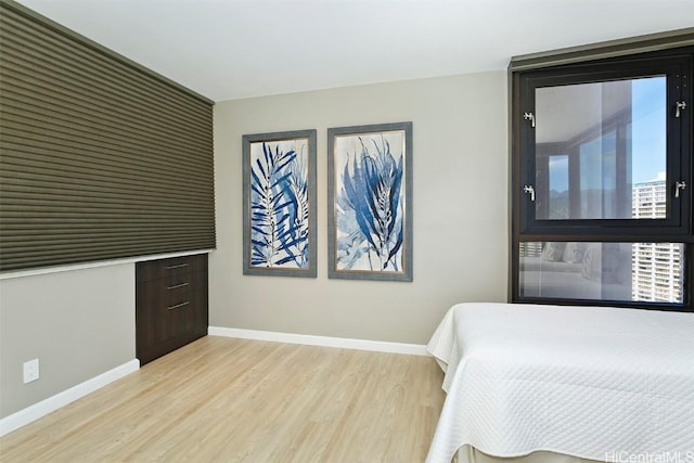 bedroom with light wood-type flooring