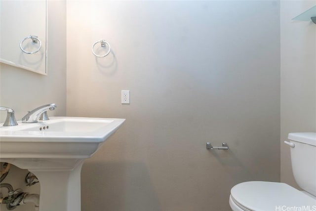 bathroom featuring sink and toilet