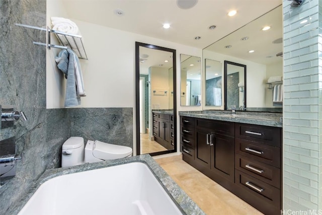 bathroom with vanity and tile walls