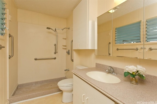 bathroom with vanity, toilet, decorative backsplash, and a shower