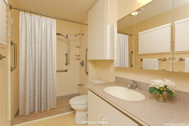 bathroom with vanity, curtained shower, a textured ceiling, and toilet