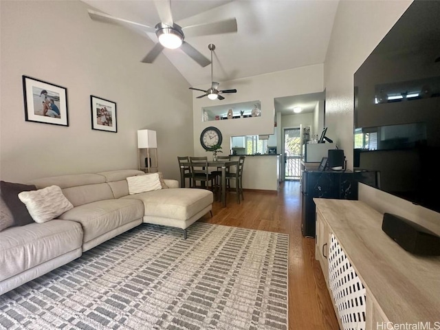 living room featuring hardwood / wood-style floors and high vaulted ceiling