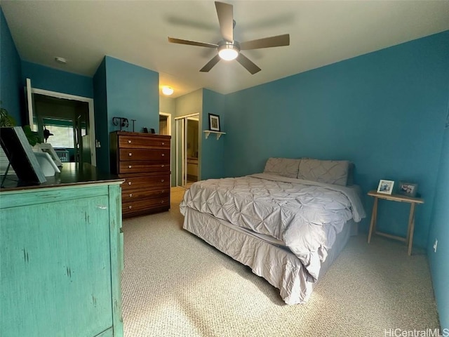 carpeted bedroom with ceiling fan and a closet