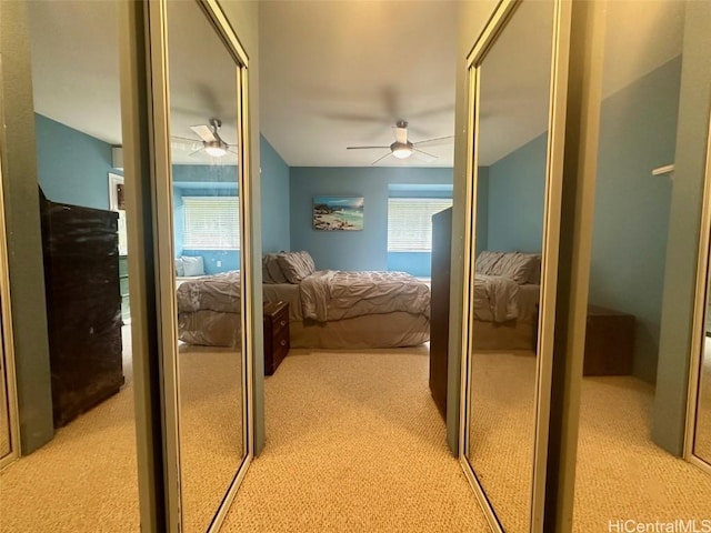 bedroom with light colored carpet and ceiling fan