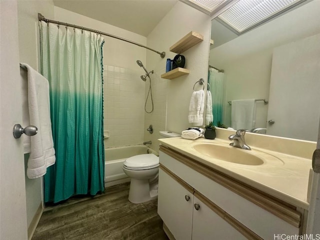 full bathroom featuring wood-type flooring, toilet, shower / tub combo, and vanity