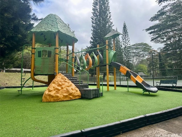 view of jungle gym with a lawn