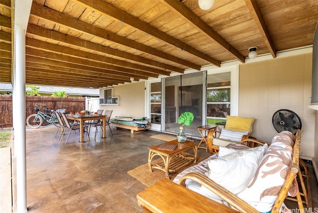 view of patio featuring outdoor dining area and fence