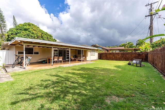 view of yard with a patio area and a fenced backyard