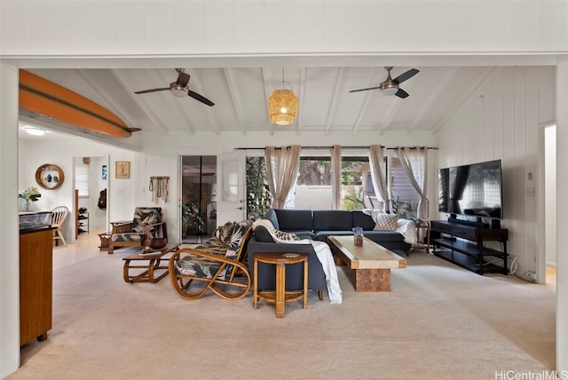 carpeted living room featuring lofted ceiling with beams and ceiling fan