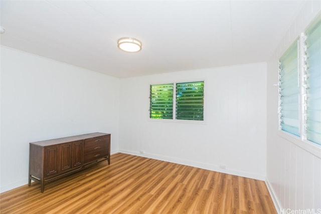 empty room with light hardwood / wood-style floors