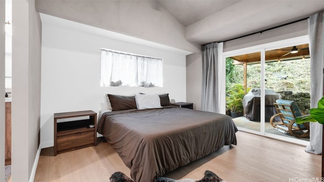 bedroom featuring access to outside and light wood-type flooring