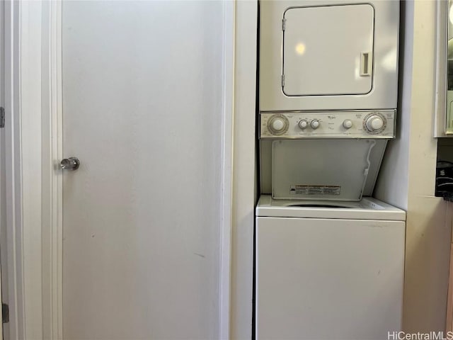 laundry area featuring stacked washer and clothes dryer