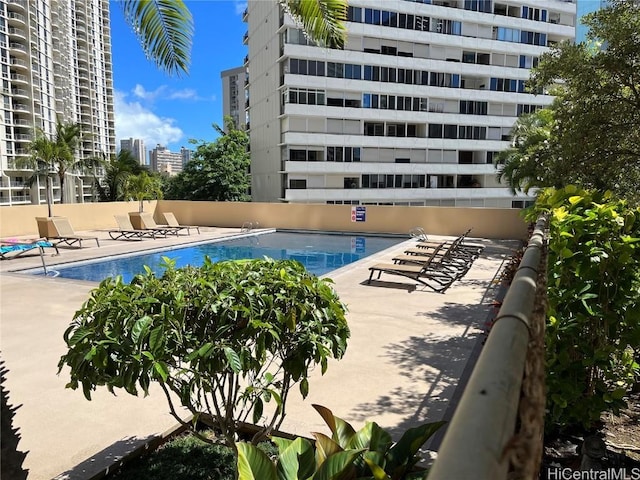 view of swimming pool featuring a patio area