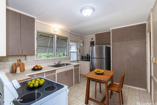 kitchen featuring appliances with stainless steel finishes and sink