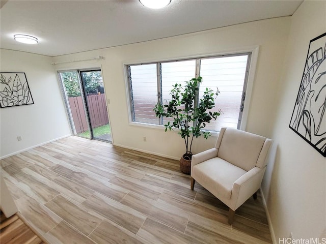 sitting room featuring light hardwood / wood-style floors