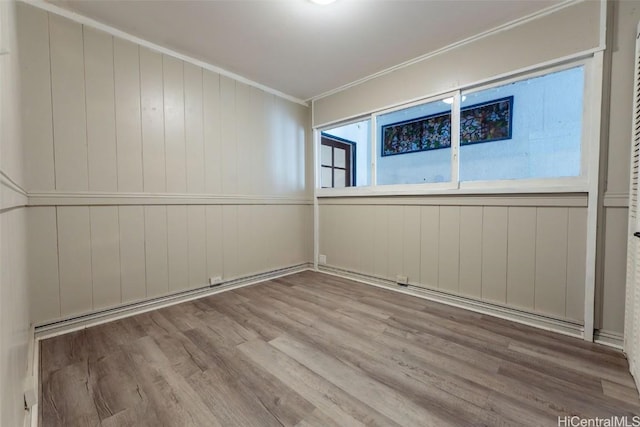 empty room featuring wood finished floors